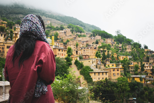 Tourist walk around Masuleh historical village in north east Iran - popular famous tourism destination in persia photo