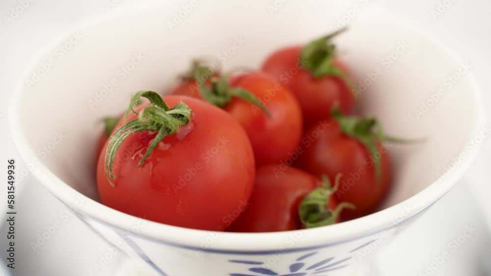 isolated tomatoes with white background on a moving platform isolated tomatoes with white background on a moving platform