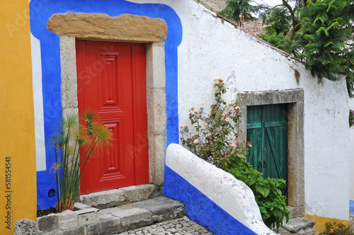 Portugal, a red door in the village of Obidos © PackShot