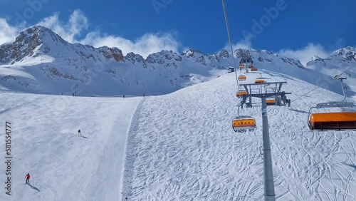 Ski lift and ski slope in a resort in the alps.