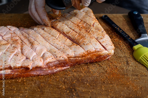 Meat preparation for BBQ.Pork belly  is a boneless and fatty cut of meat from the belly of a pig. Pork belly is particularly popular in Hispanic, Chinese, Danish, Norwegian, Korean, Thai and Filipino