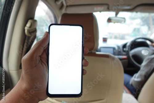  hand holding smart phone with empty screen in a car  © Towfiqu Barbhuiya 