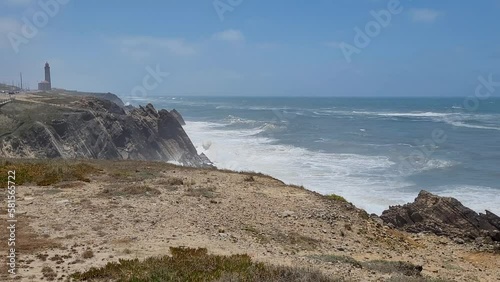 Set of big waves hits steep coast in Portugal. photo