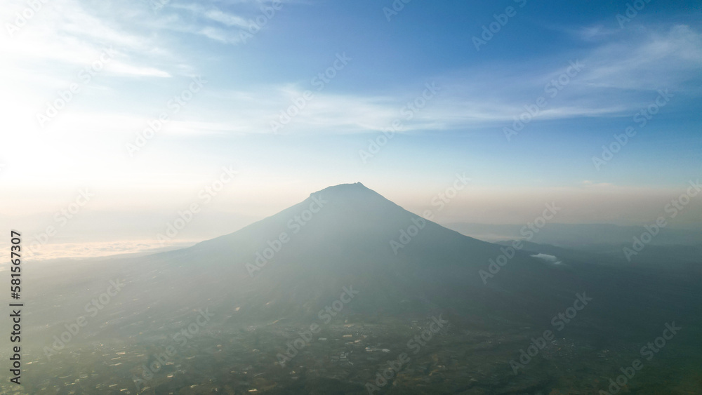 Aerial view of Mount Sumbing in Indonesia with noise cloud. High quality photo. Selective focus. Aerial view of Mount Sumbing in Indonesia with noise cloud. High quality photo. Selective focus.