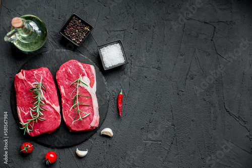 raw beef steak on stone background with copy space for your text