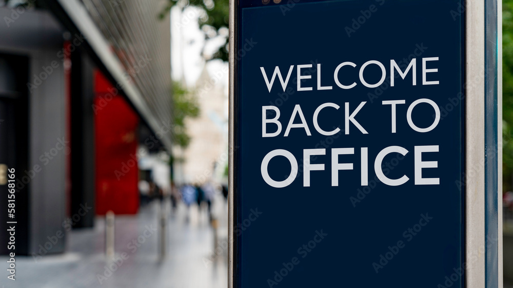 Stockfoto Welcome back to the office on a city-center sign in front of