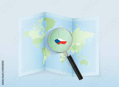 A folded world map with a magnifying lens pointing towards Czech Republic. Map and flag of Italy in loupe.
