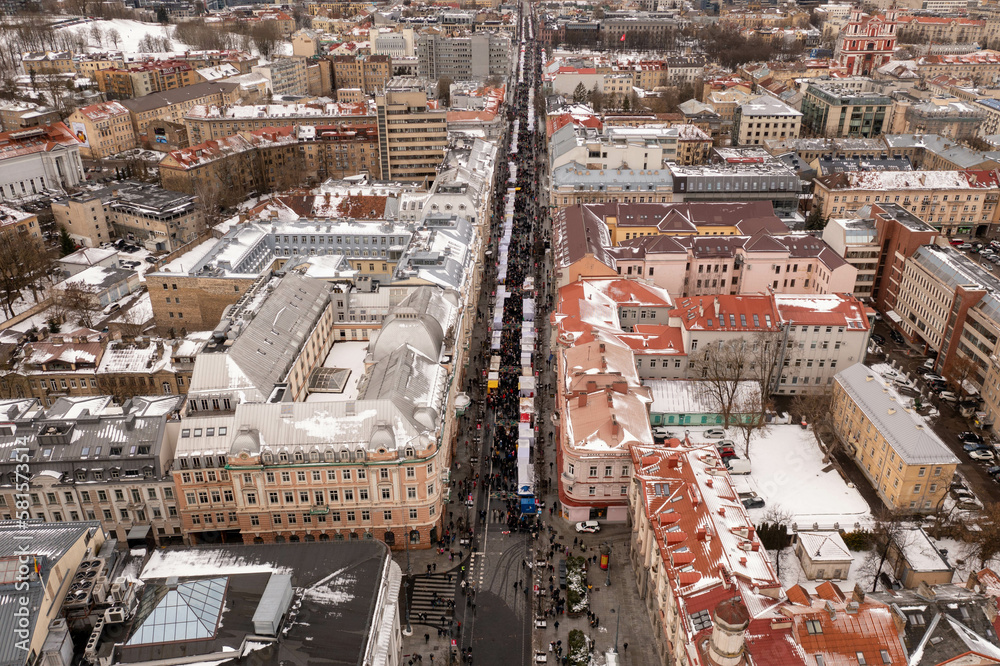 Drone photography of fair in a city center and a large crowd of people