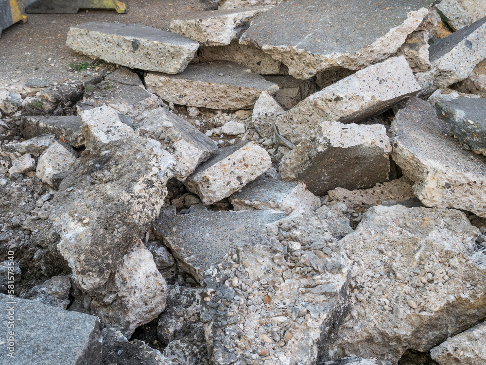 Large broken slabs of concrete pavement. Reconstruction of public