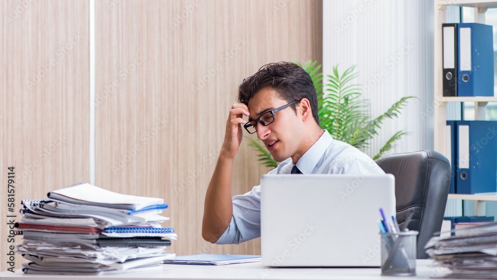 Businessman missing deadline for deliverables in office Businessman missing deadline for deliverables in office
