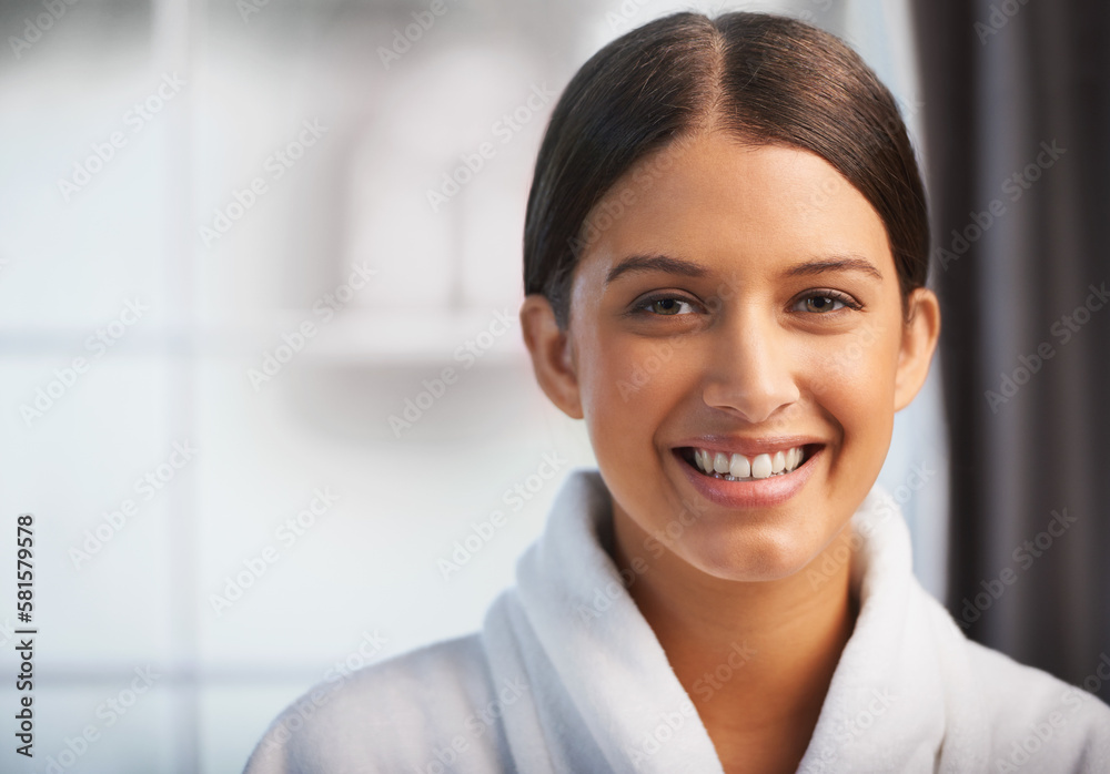 Her happy skin glows. Portrait of a beautiful young woman wearing a white robe. Her happy skin glows. Portrait of a beautiful young woman wearing a white robe.