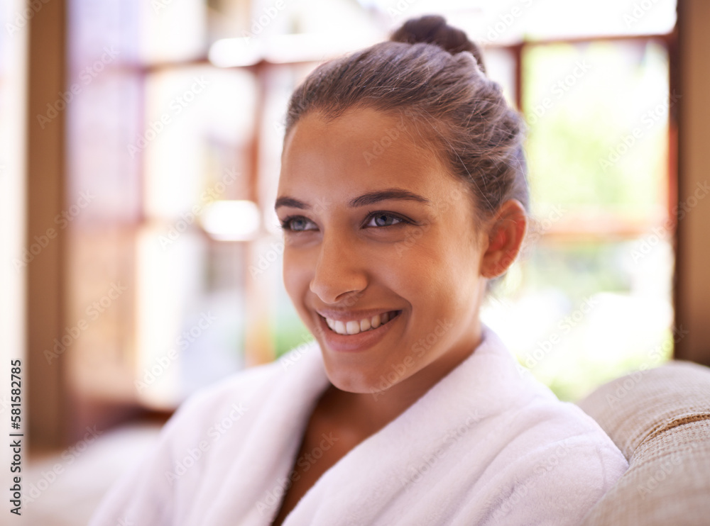 Her mood was instantly brightened. a young woman in a bathrobe at a health spa. Her mood was instantly brightened. a young woman in a bathrobe at a health spa.