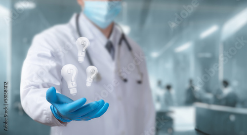 Doctor shows future ideas with question mark .