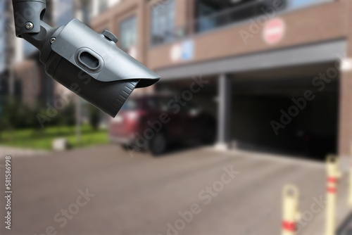 CCTV security camera on blur car parking.