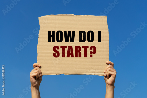 How do I start text on box paper held by 2 hands with isolated blue sky background. This message board can be used as business concept about how to start something.
