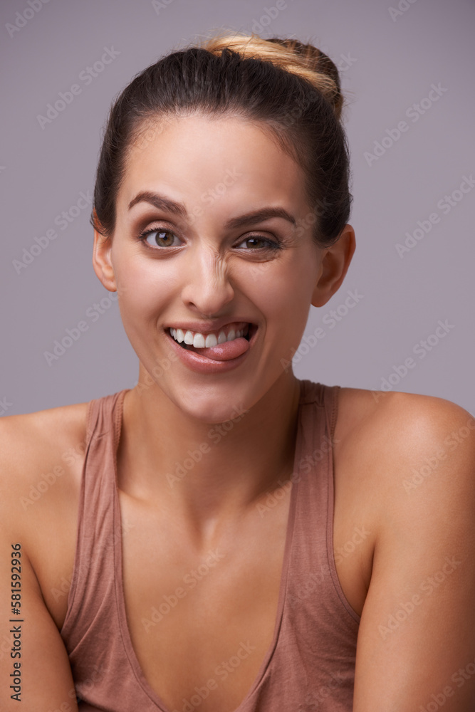 Shes got subtle con. An attractive young woman against a purple background. Shes got subtle con. An attractive young woman against a purple background.