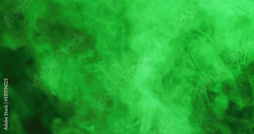 Close up of clouds of green smoke with copy space background
