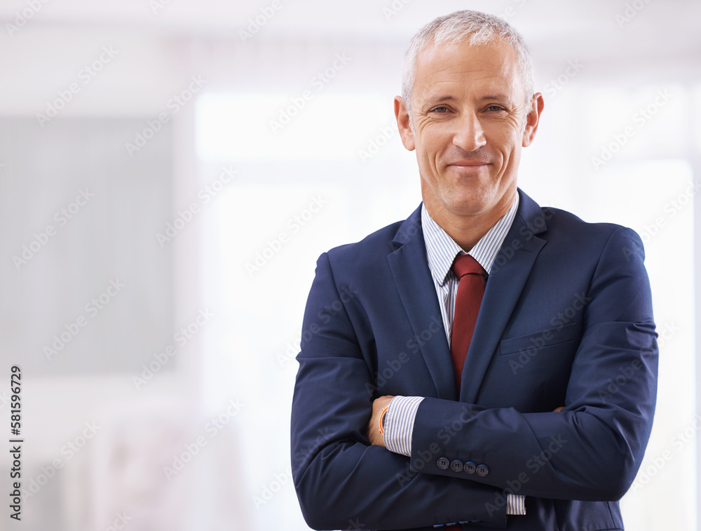 Suiting up for success. a mature businessman with folded arms. Suiting up for success. a mature businessman with folded arms.