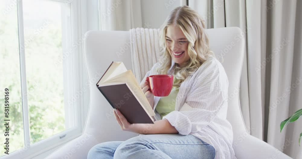 Portrait of happy caucasian plus size woman reading book and drinking coffee Portrait of happy caucasian plus size woman reading book and drinking coffee