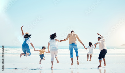 Grandparents, parents and child jump at beach for bonding, quality time and adventure together. Travel, freedom and happy big family with kids enjoy summer holiday, vacation and relax on weekend