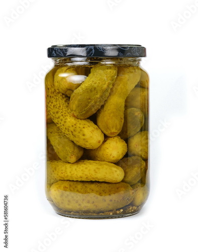 Pickled cucumbers in a transparent jar isolated on white background
