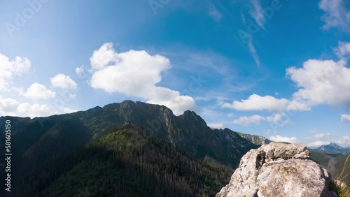 Timelapse of view of giewont against blue sky with white clouds
