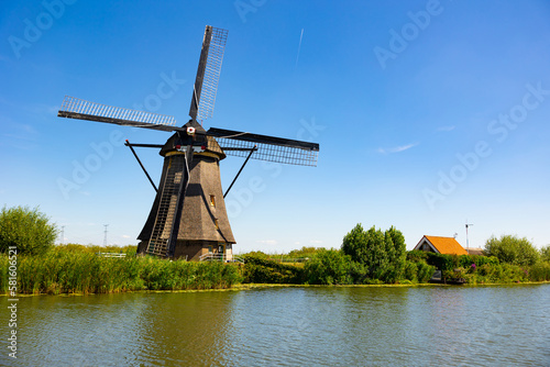 Windmills along waterside in Kinderdijk, South Holland, municipality of Molenlanden, Netherlands.