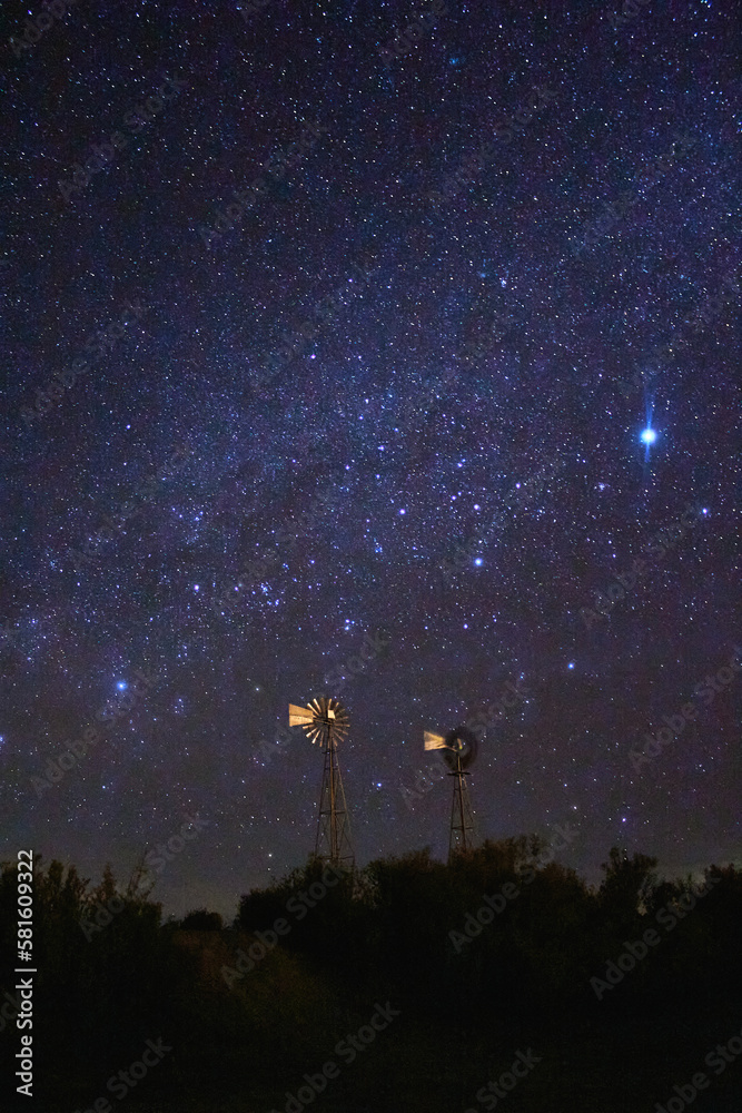 windmills at beautiful night with sky full of stars in monte escobedo zacatecas 