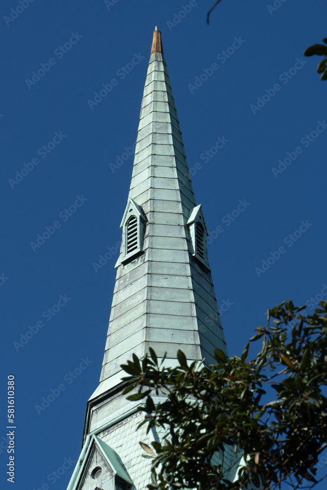 Savannah, Georgia, United States. December 2, 2022: Wesley Monument United Methodist Church with blue sky. Savannah, Georgia, United States. December 2, 2022: Wesley Monument United Methodist Church with blue sky.