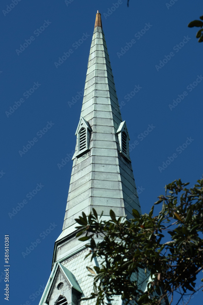 Savannah, Georgia, United States. December 2, 2022: Wesley Monument United Methodist Church with blue sky. Savannah, Georgia, United States. December 2, 2022: Wesley Monument United Methodist Church with blue sky.