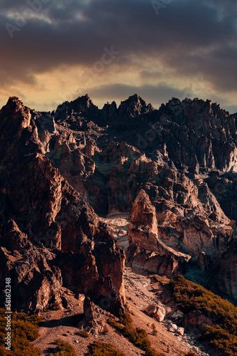 Jagged Mountain Ridge, With Sunset, Giving Off Vibrant Orange and Yellow Hues, Vertical Shot