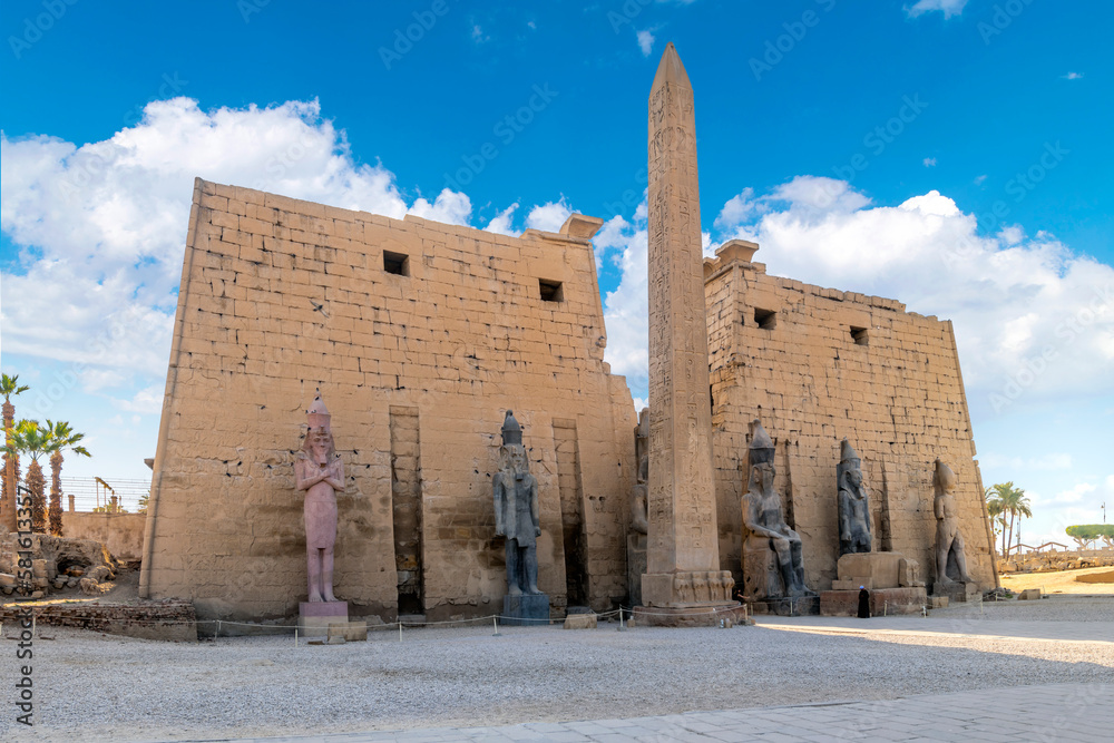 The entrance to the ancient Egyptian Luxor Temple with statues of