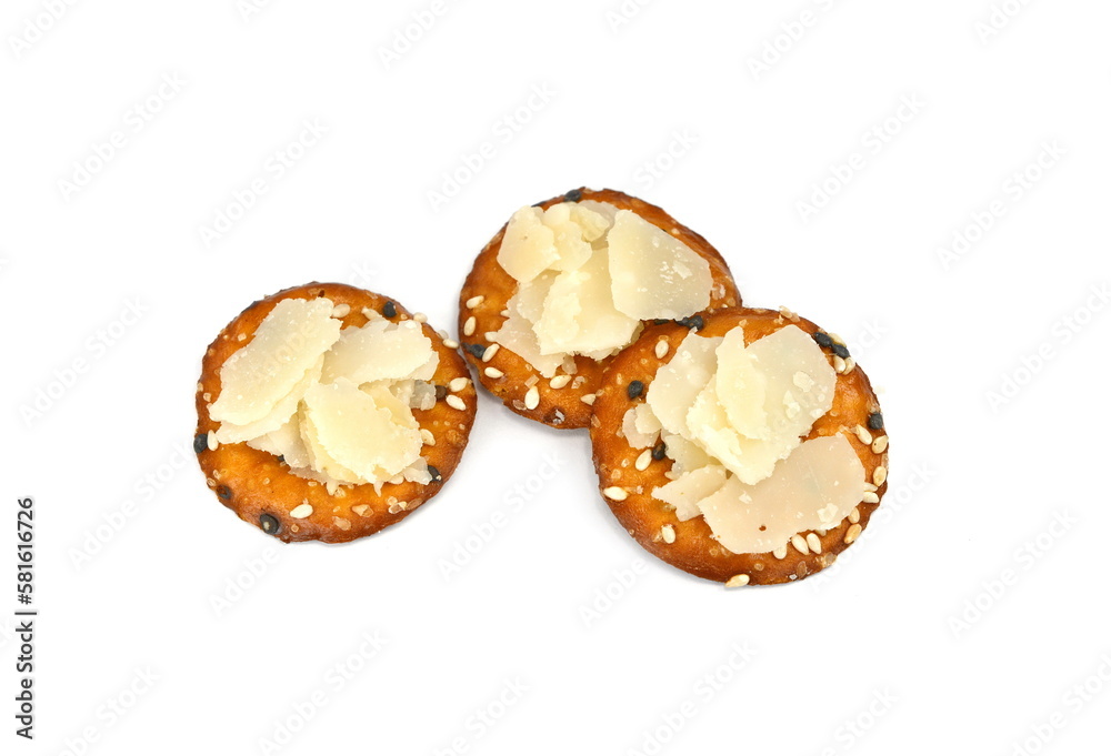 round crackers with parmigiano cheese flakes. round crackers with parmigiano cheese flakes.