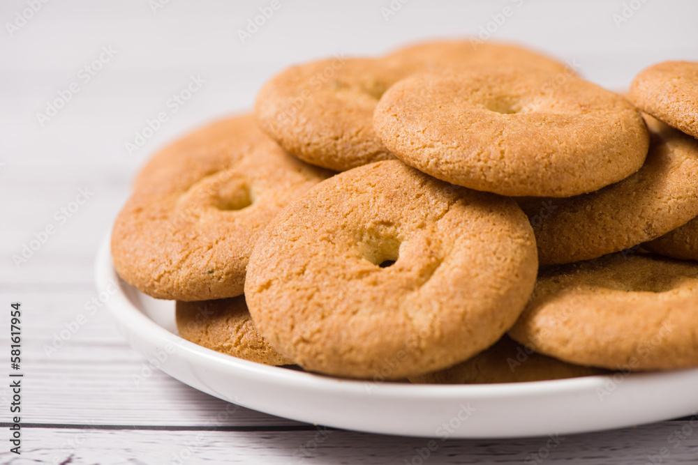 closeup of crispy round biscuits. Sweet cookies on wooden table. closeup of crispy round biscuits. Sweet cookies on wooden table.