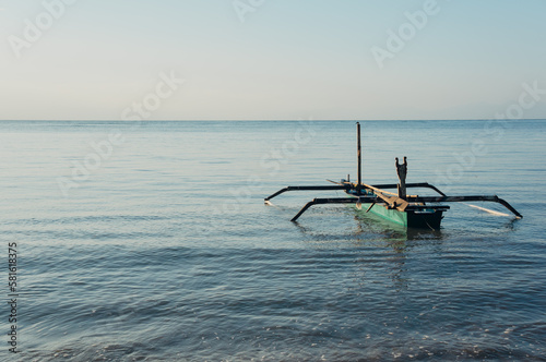 Traditional wooden boat in Bama beach, Baluran, Situbondo, Indonesia photo