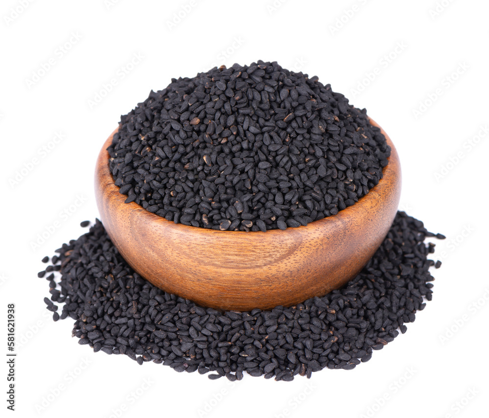 Black cumin seeds in wooden bowl, isolated on white background. Heap of black nigella seeds. Nigella sativa. Black cumin seeds in wooden bowl, isolated on white background. Heap of black nigella seeds. Nigella sativa.