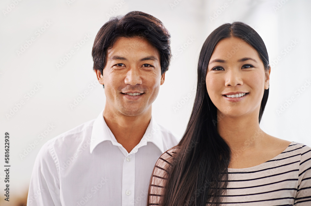 Their careers are looking promising. Cropped portrait of two smiling asian business colleagues. Their careers are looking promising. Cropped portrait of two smiling asian business colleagues.