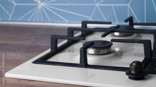Modern gas cooktop in kitchen, closeup. Space for text