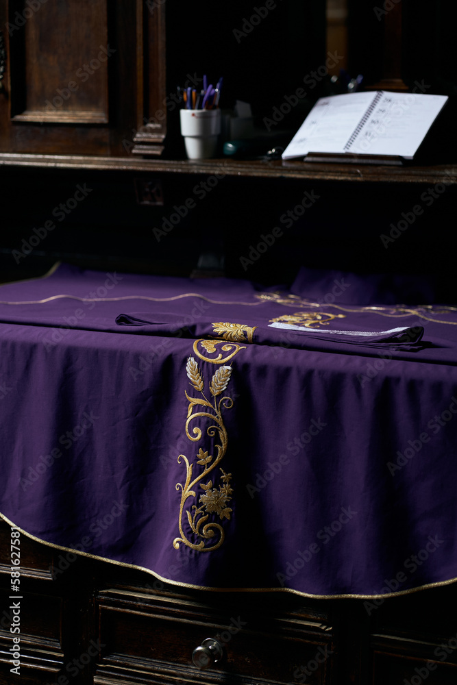 Priest chasuble in sacristy inside the catholic church, lent, purple liturgical vestments