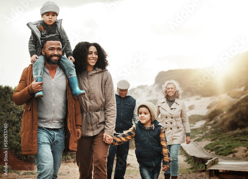 Family hiking outdoor, together with nature and happiness, bonding and spending quality time with fitness and generations. Grandparents, parents and children walking, love and care with happy people #581633760