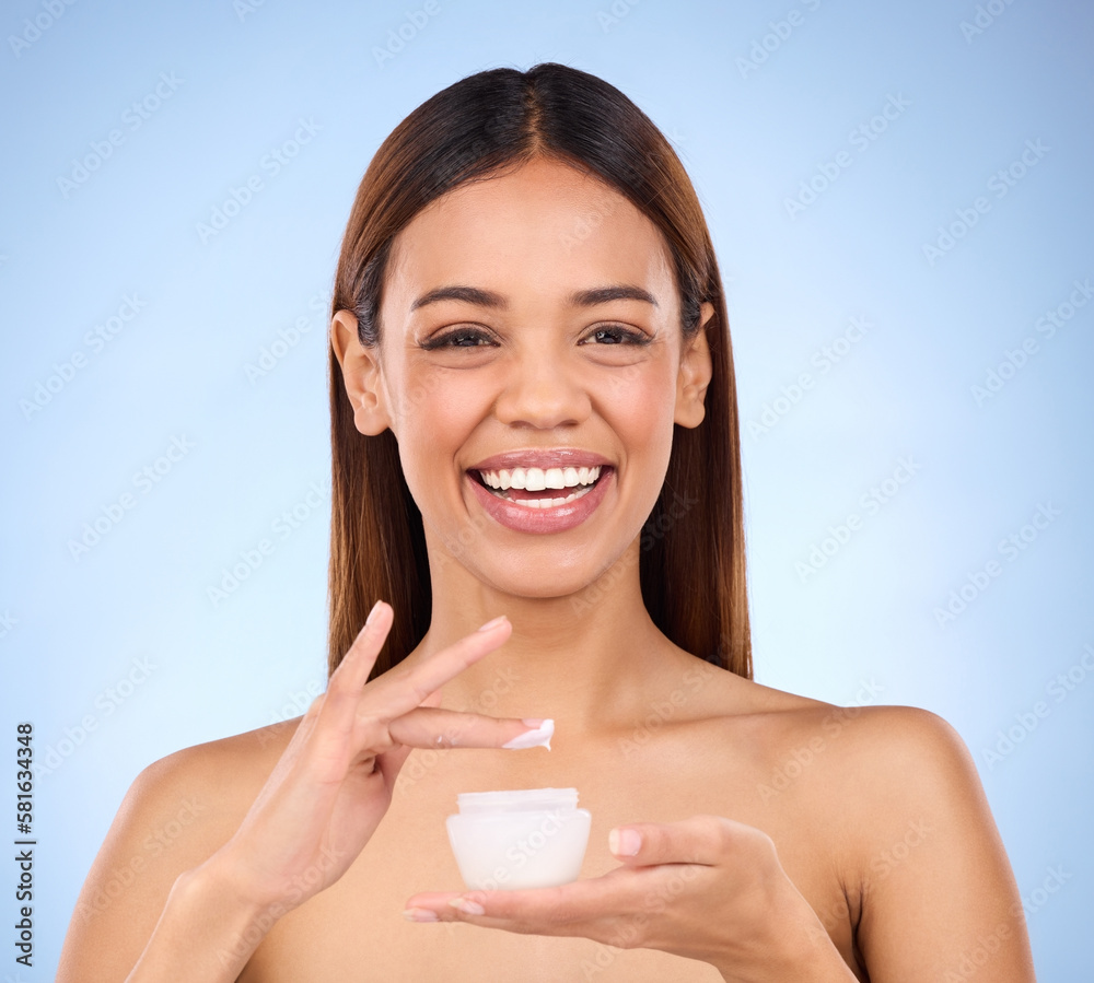 Woman, portrait and face with moisturizer creme for beauty skincare cosmetics, self love or care against a blue studio background. Happy female with lotion or moisturizing cream for soft perfect skin Woman, portrait and face with moisturizer creme for beauty skincare cosmetics, self love or care against a blue studio background. Happy female with lotion or moisturizing cream for soft perfect skin