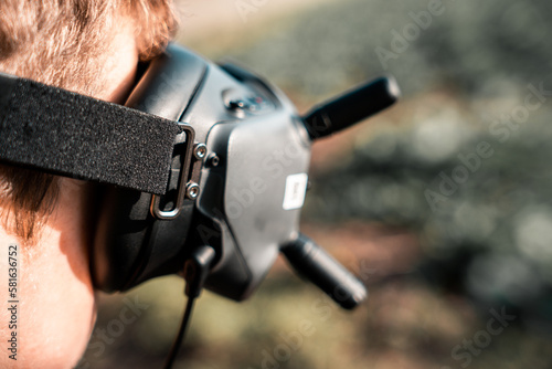 close up of a person using the fpv goggles for a dji drone