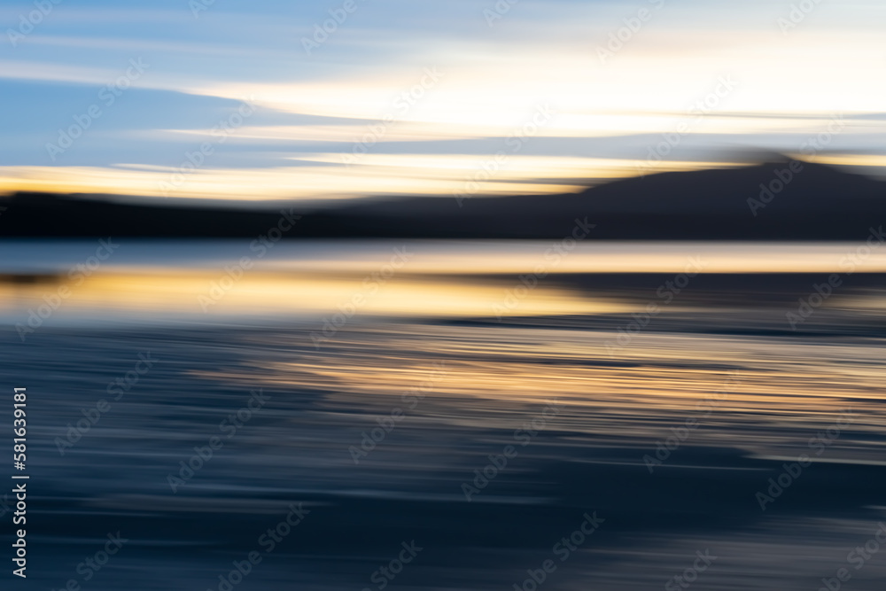 Motion blur effect in coastal sunrise for background or conceptual use