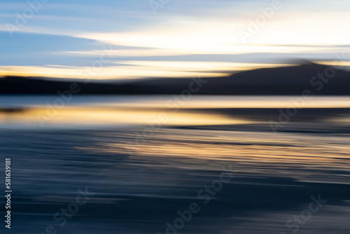 Motion blur effect in coastal sunrise for background or conceptual use
