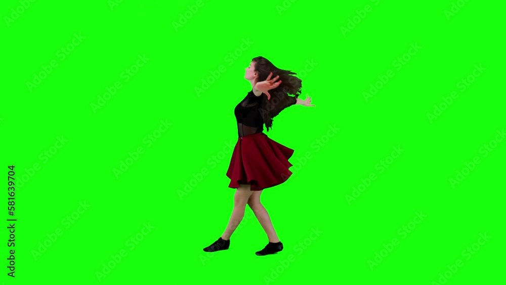 Energetic professional female dancer dancing and spinning in front of a green screen Energetic professional female dancer dancing and spinning in front of a green screen