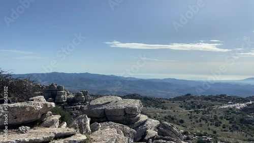 Brief tour through a mountainous area of ​​rocky paths through the karstic landscape in El Torcal de Antequera, Spain.
