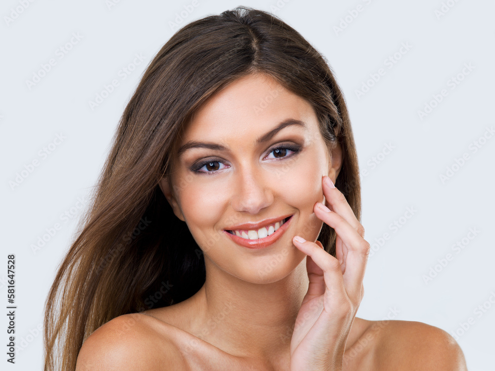 My skin is super smooth. Cropped studio portrait of a beautiful young woman touching her face. My skin is super smooth. Cropped studio portrait of a beautiful young woman touching her face.
