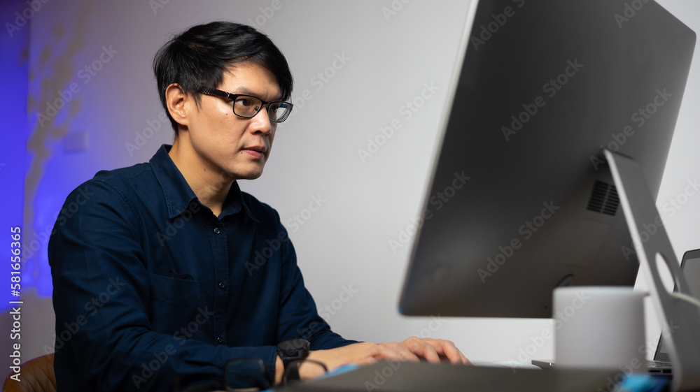 Happy excited successful Beautiful businessman in modern office with desktop computer, success happy pose. Work from home and social distancing concept