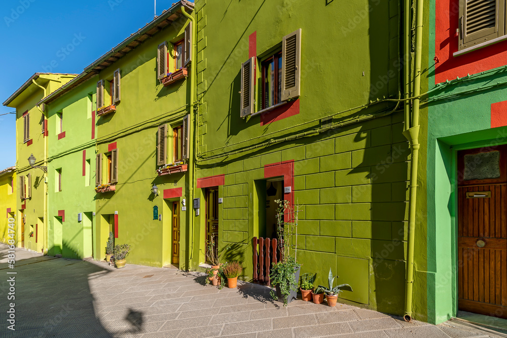 The colorful typical houses of Via di Mezzo street, Ghizzano, Pisa, Italy