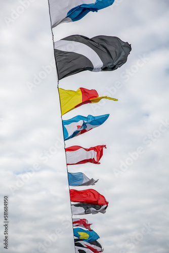 International maritime signal flags. Signal flags are displayed on the bridge over the Neva River during the Naval parade in St. Petersburg